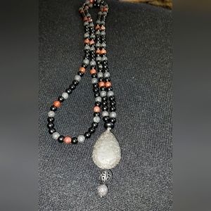Carnelian, obsidian, and lava rock necklace.